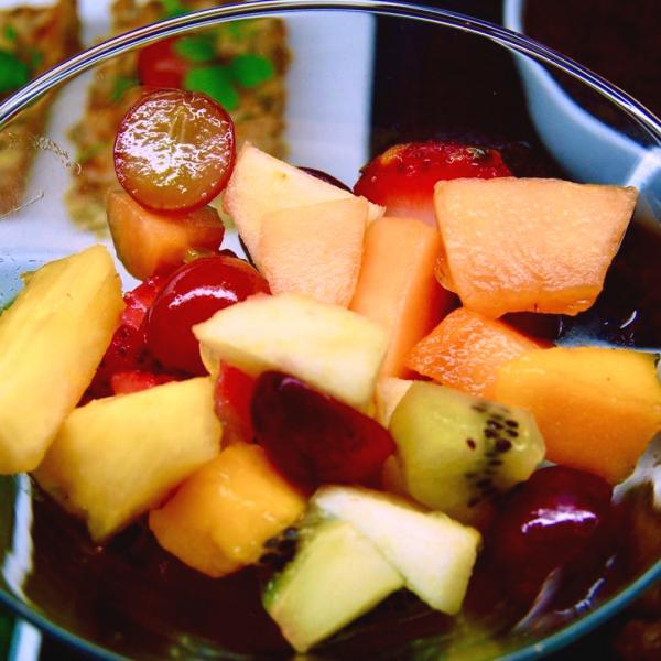 Fresh fruit with iced mint tea and spices 

